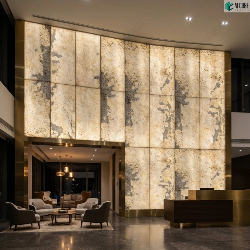 Grand hotel lobby with double-height illuminated SP Rock 3 Stone Veneer