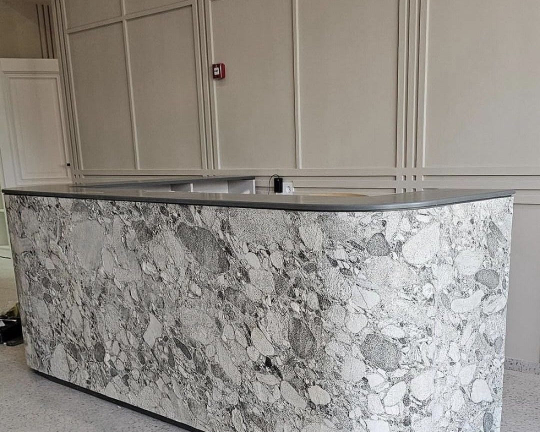 Table with a base made using flexible Fusion Marble stone veneer from M Cube Spaces.